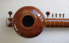 back side of sitar showing top gourd attached and soundhole