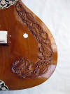 lotus carvings on right side of sitar tabli